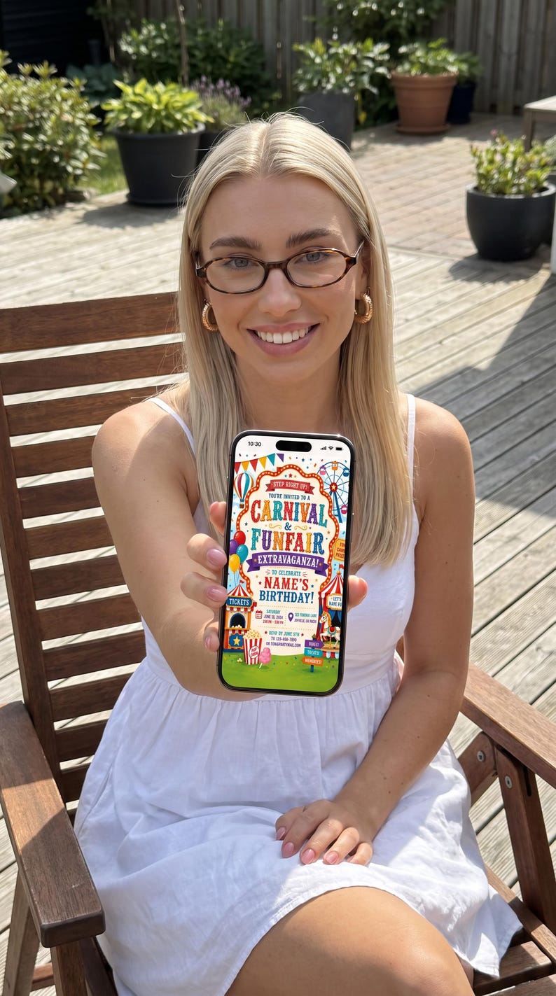 May include: A smartphone displaying a colorful digital carnival and funfair birthday invitation. The screen features text reading Step Right Up! You're Invited To A Carnival & Funfair Extravaganza To Celebrate Name's Birthday, with graphics of tents, balloons, and a Ferris wheel.