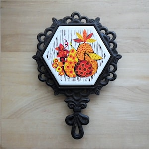 Cast Iron Trivet w/ Fruit, Pears - Ceramic Tile Center - Vintage Wall Hanging 9&quot; - Kitchen Decor - Orange, Red, Black - MCM - Midcentury