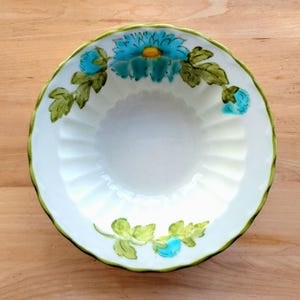 May include: A rustic wooden sign with the text "Welcome to our home" in white lettering. The sign features a distressed finish and a simple, inviting design, perfect for a front porch or entryway.