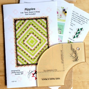 May include: A quilting pattern packet titled "Ripples" with a matching clear acrylic ruler. The pattern features a geometric design in green, white, and pink. The packet includes instructions and a tool for making the quilt.