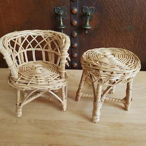 May include: A set of three ceramic mugs with a speckled, matte finish. The mugs are in shades of cream, light gray, and dark gray. Each mug has a simple, minimalist design and a rounded handle.