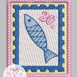 May include: An embroidered patch shaped like a postage stamp with a scalloped blue border, a pale yellow frame, and a white center. A blue fish is stitched in the middle, and the pink text 20c is positioned in the upper right corner.