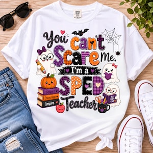 May include: A white t-shirt featuring a colorful Halloween-themed graphic with the text "You can't scare me, I'm a SPED teacher." The design includes three ghosts, a stack of books labeled Support, Encourage, and Inspire, a pumpkin, and a spider web.