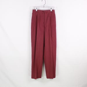 May include: A pair of burgundy high-waisted trousers with a straight leg.