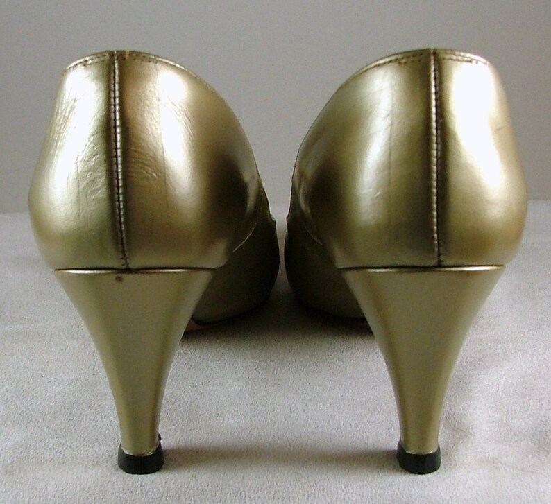 gold leather pumps