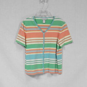 May include: A striped short-sleeved button-down shirt with a v-neck. The shirt is green, blue, orange, and white.