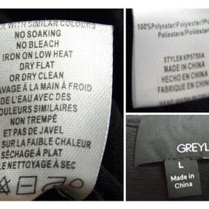 May include: White care label with instructions for washing and drying a garment in English and French. The label also includes a symbol for dry cleaning. The label is attached to a black garment with a black tag that says "GREYLIN" and "Made in China".