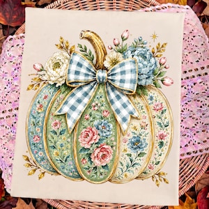May include: A rectangular canvas print featuring a central pumpkin illustration on a beige background. The pumpkin is decorated with intricate floral patterns in shades of pink, blue, and green, topped with a large blue and white gingham bow.