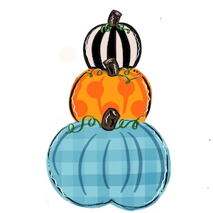 Puede incluir: Una pila de tres calabazas, la de abajo es azul con un patrón de cuadros, la del medio es naranja con un patrón de lunares y la de arriba es de rayas blancas y negras.