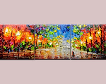 May include: A three-panel painting depicting a colourful forest scene with a couple walking along a path. The trees are painted in shades of red, orange, yellow, green, and blue. The path is lined with trees and leads to a clearing in the distance. The painting is done in a thick, impasto style, giving it a textured look.