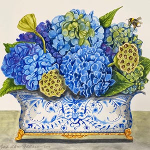 May include: Watercolor painting of a floral arrangement featuring vibrant blue hydrangeas, green leaves, and seed pods. The flowers are in a decorative blue and white porcelain vase with gold accents. A bee hovers near the flowers. Signed "Mark Allen Ballard 2025".