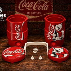 May include: Two red cylindrical Coca-Cola beverage coolers with matching lids, one featuring the Coca-Cola logo and the other a polar bear graphic. Includes a white handle and small white components. The lids mirror the cooler designs with logo and bear graphics.