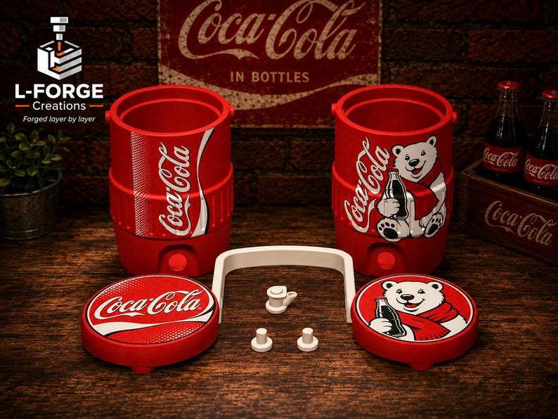 May include: Two red cylindrical Coca-Cola beverage coolers with matching lids, one featuring the Coca-Cola logo and the other a polar bear graphic. Includes a white handle and small white components. The lids mirror the cooler designs with logo and bear graphics.