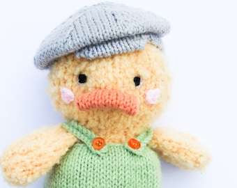 Darwin Duck wearing dungarees and a flatcap knitting pattern instructions PDF