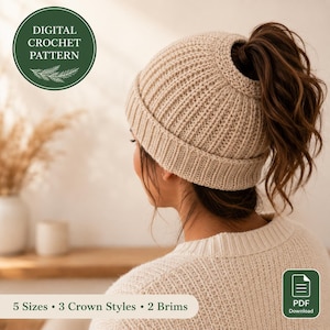 May include: A beige ribbed crochet beanie with a hole at the top for a ponytail. The image includes text stating Digital Crochet Pattern, 5 Sizes, 3 Crown Styles, 2 Brims, and PDF Download. The beanie features a folded cuff and textured knit.