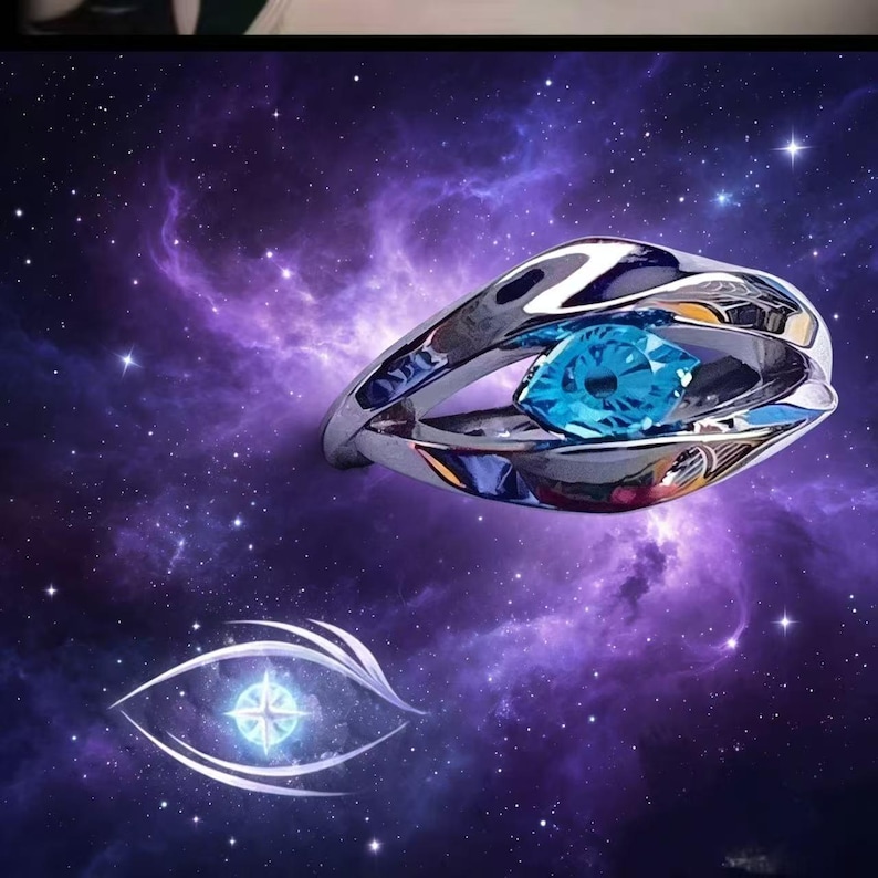 May include: A silver-toned metal ring featuring a polished, organic, flowing band design that wraps around a central, marquise-cut, bright blue gemstone. The ring is displayed against a deep purple and blue cosmic nebula background with stars.