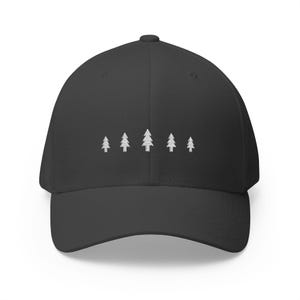 May include: A charcoal gray baseball cap featuring an embroidered design of five white pine trees arranged in a horizontal row across the front panel. The cap has a structured crown, a curved brim, and a button at the top center of the crown.