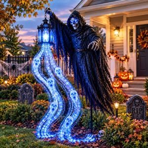 May include: A life-sized grim reaper figure wearing a tattered black hooded robe with glowing blue eyes, holding a lantern that emits a cascading stream of blue LED light shaped into multiple ghostly skull faces, standing in a yard.