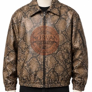 May include: A brown and black snakeskin-patterned leather jacket with a full-length front zipper, a pointed collar, and elasticized cuffs and hem. The jacket features a circular logo on the chest with the text NORVAN LEATHER.