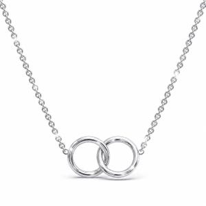 May include: A silver-toned necklace featuring a delicate chain and two interlocking circular rings as the central pendant. The metal has a polished, reflective finish, and the design consists of two smooth, plain hoops connected to the chain links.