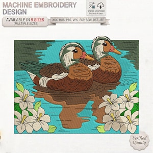 May include: A machine embroidery design featuring two brown and white ducks swimming in turquoise water, surrounded by white flowers with yellow centres. The text reads MACHINE EMBROIDERY DESIGN, AVAILABLE IN 9 SIZES, and XXX. HUS. PES. VPS. EXP. SEW. DST. JEF.