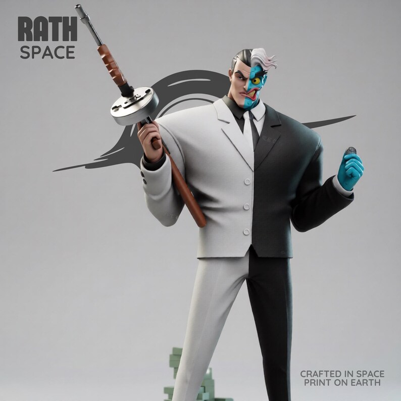 May include: A statue of the DC Comics villain Two-Face, split down the middle with a white and black suit. He holds a Tommy gun in one hand and a coin in the other. The statue has the text "RATH SPACE" and "CRAFTED IN SPACE PRINT ON EARTH".