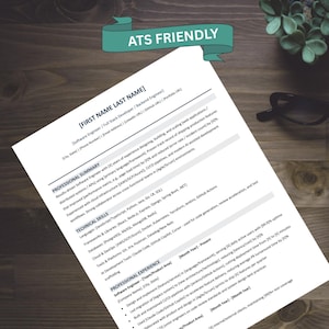 May include: A white resume template printed on paper with black text, featuring sections for professional summary, technical skills, and professional experience. A teal banner at the top contains the white text ATS FRIENDLY.