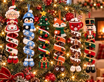 May include: Six crocheted Christmas ornaments hanging on a tree, featuring a Mrs Claus, a penguin, a Christmas tree, a fox, a mug of hot cocoa, and a nutcracker, each with a long, spiralling, colourful tail ending in small feet.