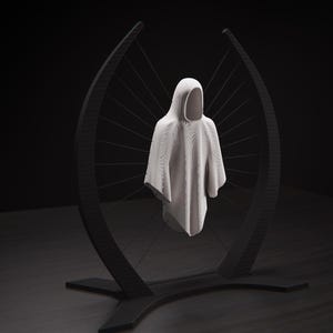 May include: A white hooded garment with a textured surface suspended within a black, curved, crescent-shaped frame. The garment is held in place by thin, taut black wires that connect the fabric to the interior edges of the dark, arched structure.