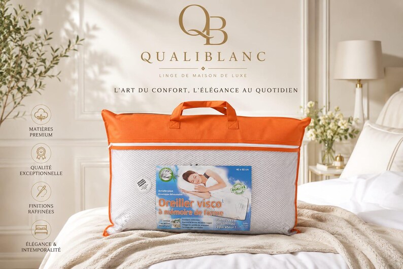 May include: A rectangular white memory foam pillow encased in a clear plastic bag with orange fabric trim and handles. The packaging features a label with the text Oreiller visco &agrave; m&eacute;moire de forme, an illustration of a person sleeping, and dimensions of 40 x 60 cm.