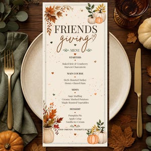 May include: A rectangular Friendsgiving menu card featuring autumn-themed illustrations of pumpkins and fall foliage. The text lists starters, main course, sides, and dessert options in a dark brown font against a cream-coloured background.