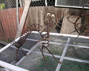 Yard art cat made from garage door spring