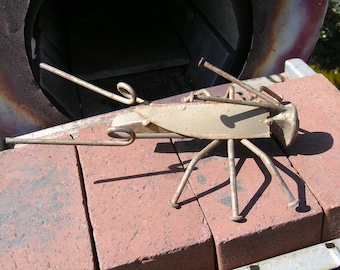 Hand made cricket out of a rail road spike approx. 10x6x4