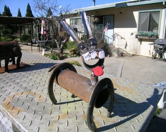 Horseshoe donkey from recycled shoes and pipe