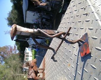 Railroad spike guy braking a golf club over his knee