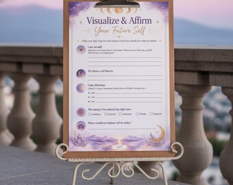 Puede incluir: Un portapapeles sobre un soporte de metal decorativo con una hoja de trabajo Visualize & Affirm Your Future Self con gráficos celestiales en morado y dorado, incluyendo lunas, estrellas y cristales, con líneas en blanco para escribir.