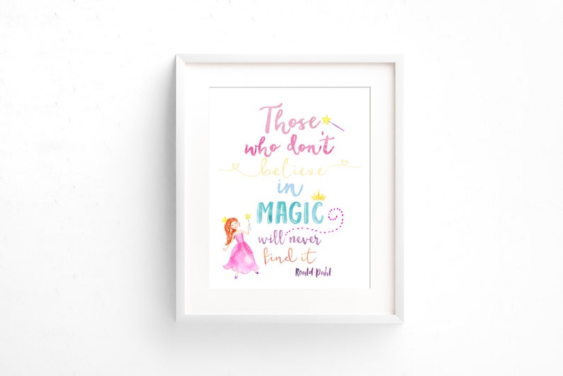 May include: A white framed print with a watercolor illustration of a princess holding a wand. The quote "Those who don't believe in magic will never find it" is written in colorful script with the author "Roald Dahl" at the bottom.
