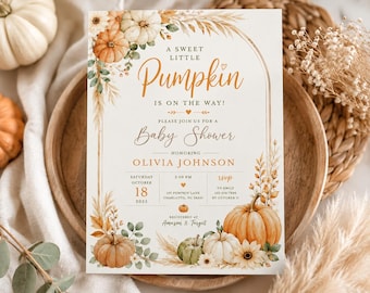 May include: A rectangular baby shower invitation card featuring a cream background with an arched gold frame. The design includes watercolor illustrations of orange, white, and green pumpkins, pampas grass, and flowers. Text reads A SWEET LITTLE PUMPKIN IS ON THE WAY, BABY SHOWER, OLIVIA JOHNSON, OCTOBER 18 2025, and RSVP details.