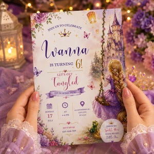 May include: A rectangular birthday invitation card featuring a purple and gold colour scheme with a castle, a character with long blonde hair on a swing, butterflies, and floral accents. The text reads: Join us to celebrate Ivanna is turning 6! Let's get tangled up in some fun! Sunday 17 July at 4-6 PM, 123 Anywhere St., Any City, ST 12345, RSVP Mom 123-456-789, Dream Big Sparkle More Shine Bright Little One.