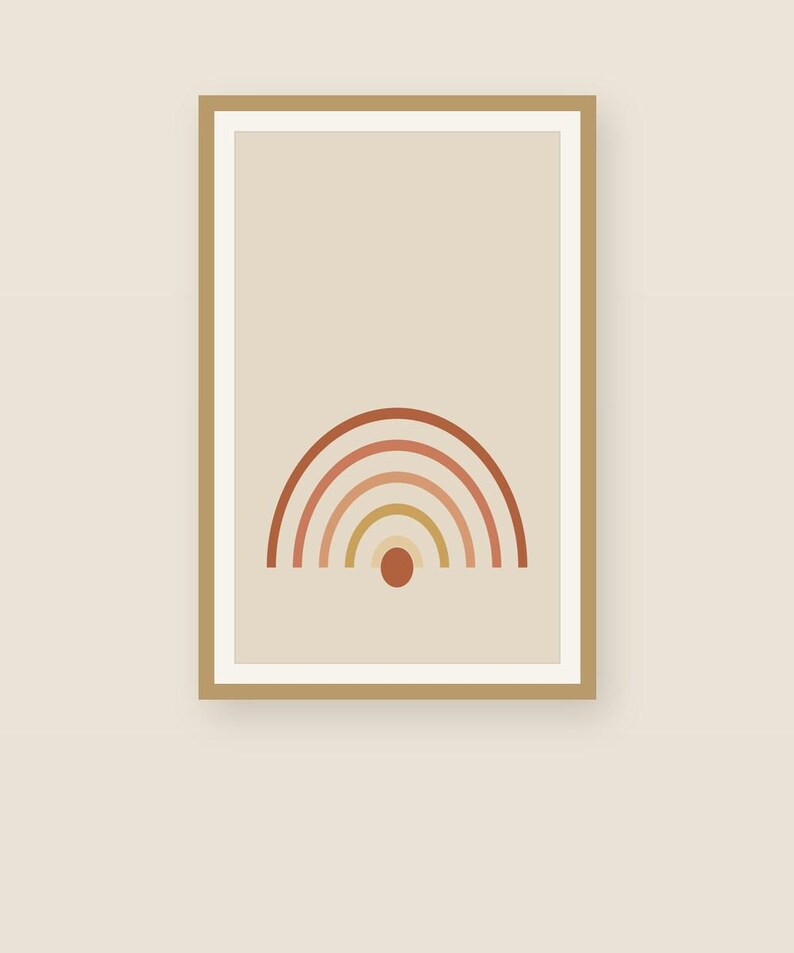 May include: A framed wall art print featuring a centered graphic of a semi-circular rainbow composed of five concentric arches in shades of terracotta, rust, and muted yellow, with a solid terracotta circle positioned directly below the center.