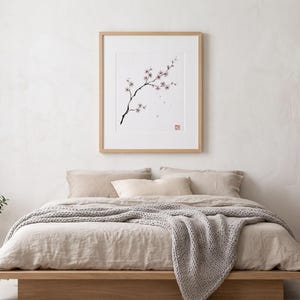 Cherry Branch sakura branch in ink print styled in a calm Japandi room — soft pink and cream. Calm & Oak.