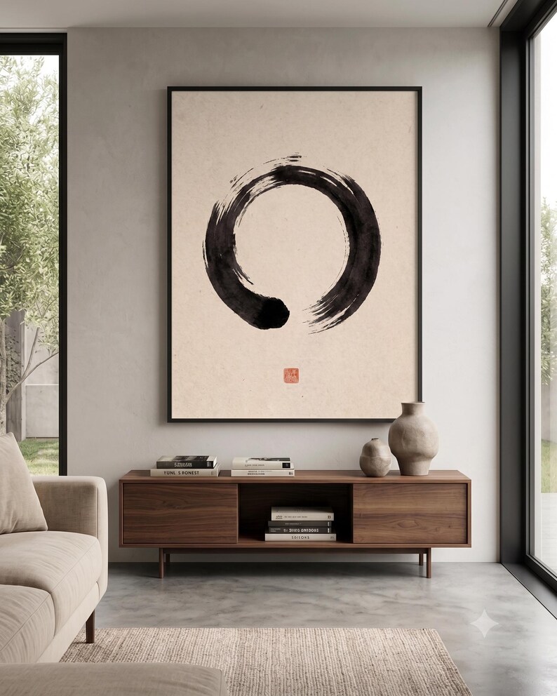 Framed Sumi Enso print displayed above a modern console table in a Japandi-inspired living room with neutral decor.