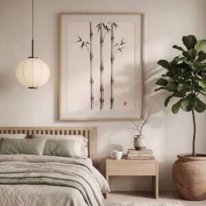 Three Bamboo three ink bamboo stalks print styled in a calm Japandi room — warm off-white. Calm & Oak.
