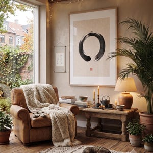 Framed Sumi Enso print displayed above a modern console table in a Japandi-inspired living room with neutral decor.