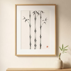 Three Bamboo three ink bamboo stalks print styled in a calm Japandi room — warm off-white. Calm & Oak.