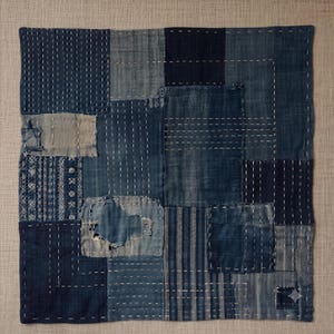 Japanese Boro Indigo wall art featuring layered textile-inspired patterns in deep blue tones with a wabi-sabi aesthetic.