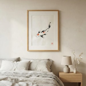 Koi ink koi fish with vermillion accent print styled in a calm Japandi room — warm off-white. Calm & Oak.
