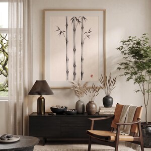 Three Bamboo three ink bamboo stalks print styled in a calm Japandi room — warm off-white. Calm & Oak.