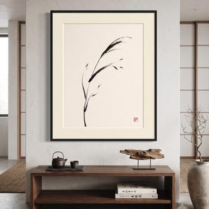 Minimalist Sumi-e Bent Reed print featuring Japanese ink brushwork of a graceful reed bending softly on warm white paper.