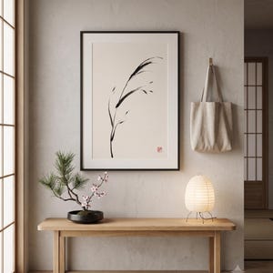 Minimalist Sumi-e Bent Reed print featuring Japanese ink brushwork of a graceful reed bending softly on warm white paper.